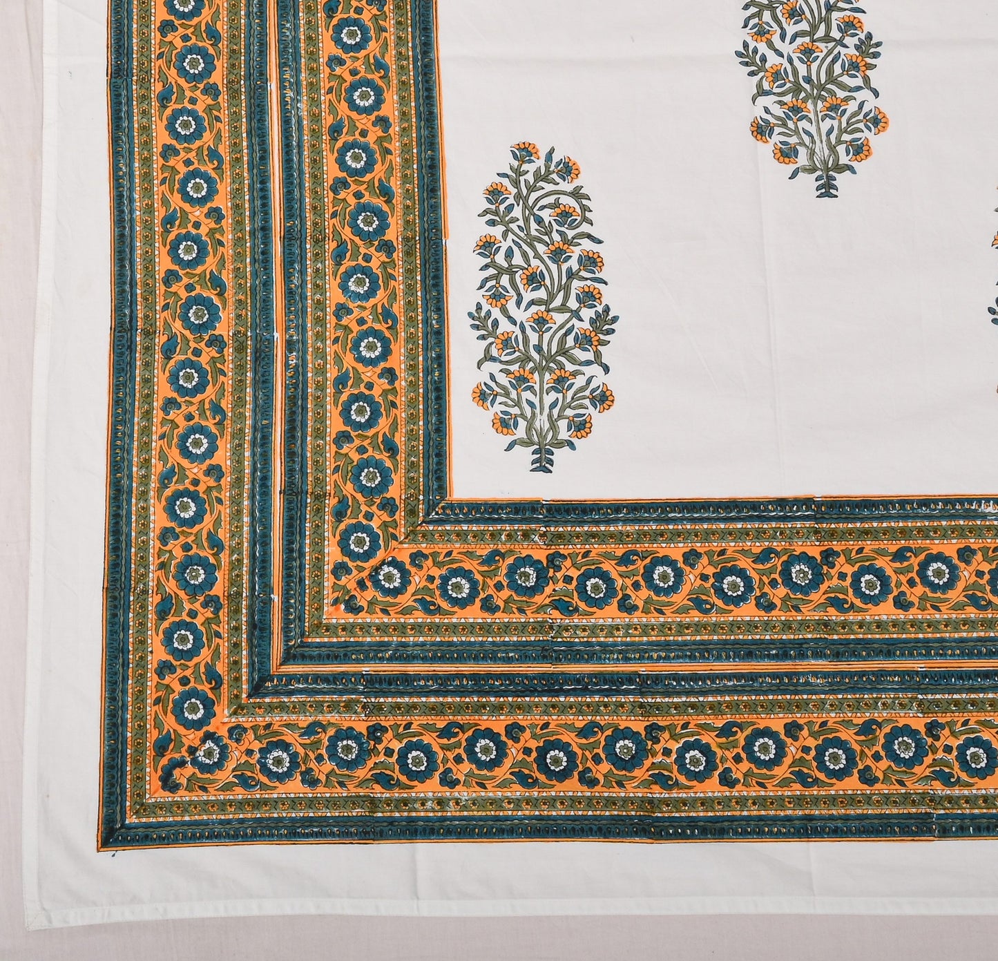 Decorative fabric with intricate patterns and colors on a white background