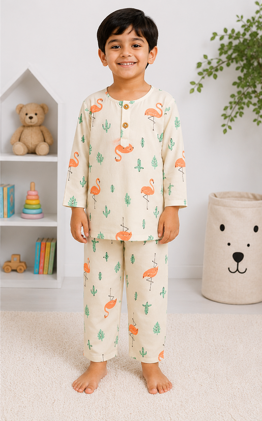 Child wearing a pajama set with animal prints in a room setting.