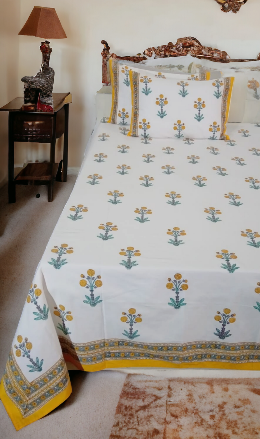 Bed with floral patterned bedspread in a bedroom setting