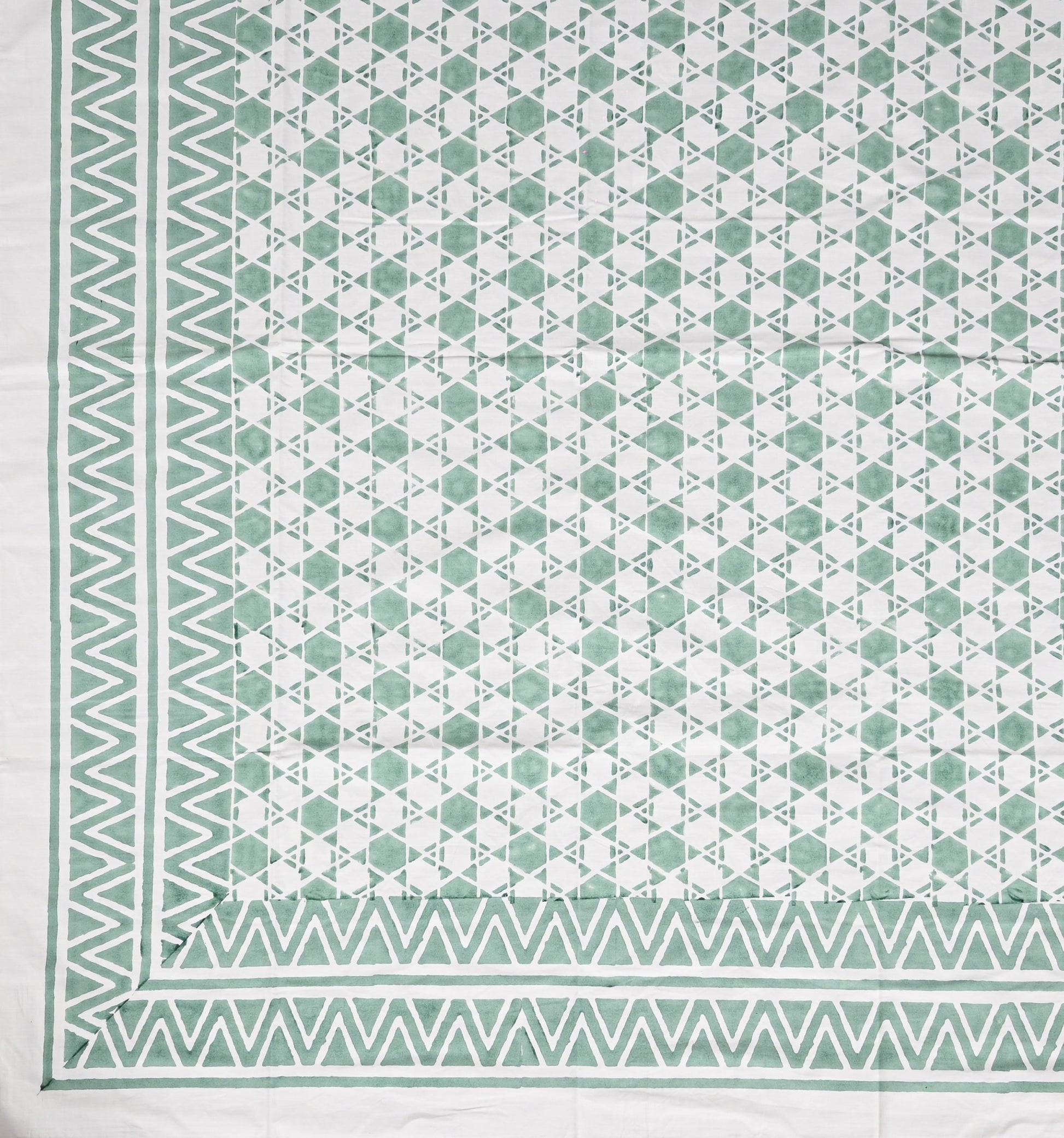 Geometric patterned fabric with green and white colors