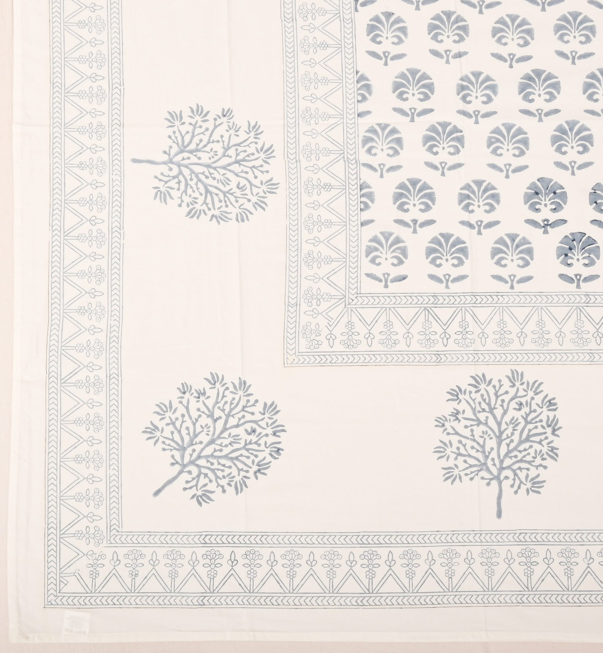 Decorative fabric with tree and geometric pattern on a white background